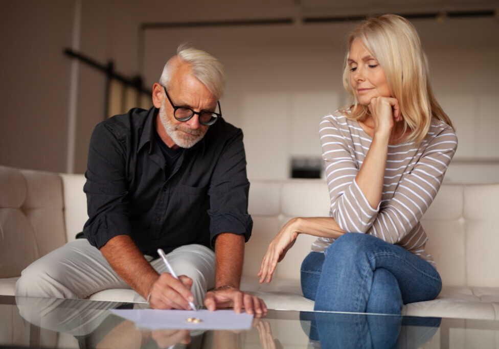 The severance of relations between an mature man and a woman. Signing a document for divorce. Difficulties in family relationships.